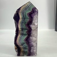 265bc2b3-0a9d-53af-ae33-971739012cc9-1.jpg Rainbow Fluorite Polished Point -Live Edge | 2.G