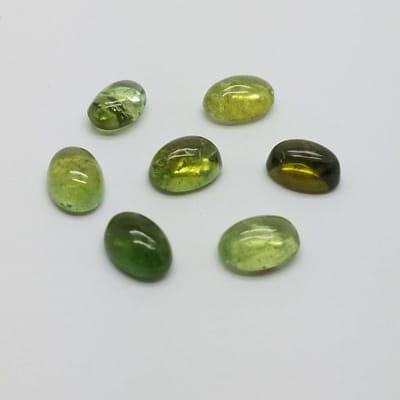 a6ef64a4-6bd8-56ad-91b0-f61cff04056f-1.jpg Green Tourmaline Oval Cabochons 7Pc Lot