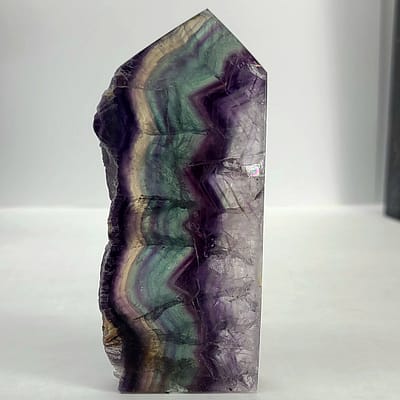 265bc2b3-0a9d-53af-ae33-971739012cc9-1.jpg Rainbow Fluorite Polished Point -Live Edge | 2.G