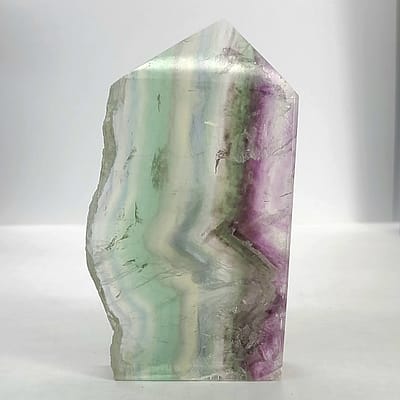 a19733cd-1d8b-554b-b607-04d96bd2b319.jpg Rainbow Fluorite Polished Point -Live Edge | 2.G