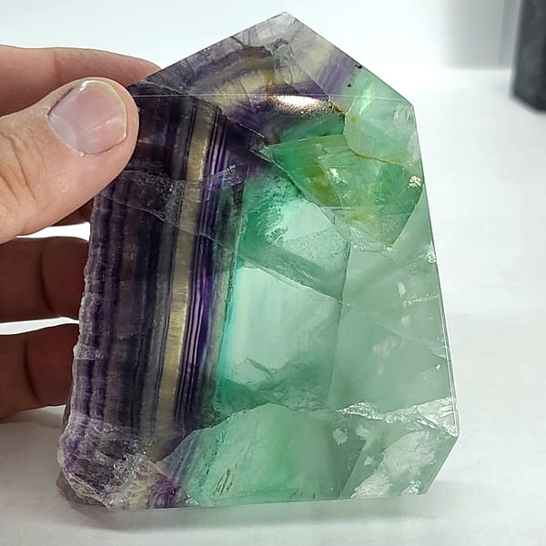 a694b859-dc2e-5ad5-b4df-8d2f01e96569-1.jpg Rainbow Fluorite Polished Point -Live Edge | 2.G
