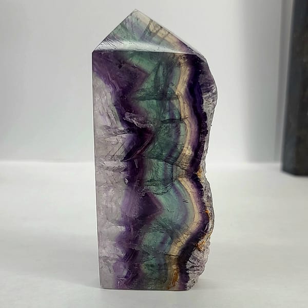 c5292ac4-31ad-5c36-8233-acedfe59b5dd-1.jpg Rainbow Fluorite Polished Point -Live Edge | 2.G