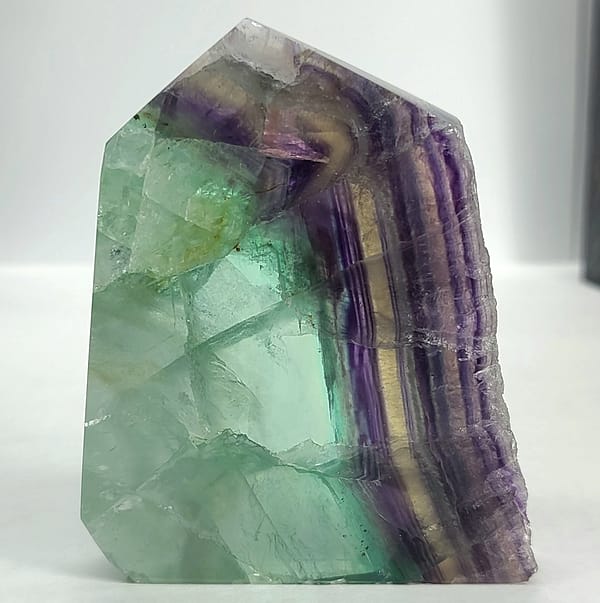 15fb60d7-7c48-5e60-bd8d-ff1e35d635df-1.jpg Rainbow Fluorite Polished Point -Live Edge | 2.G